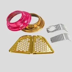 Assorted Decorative Plastic Components - Bigmate Philippines Inc. Assorted decorative plastic components in various colors and shapes, including gold, pink, and silver pieces.